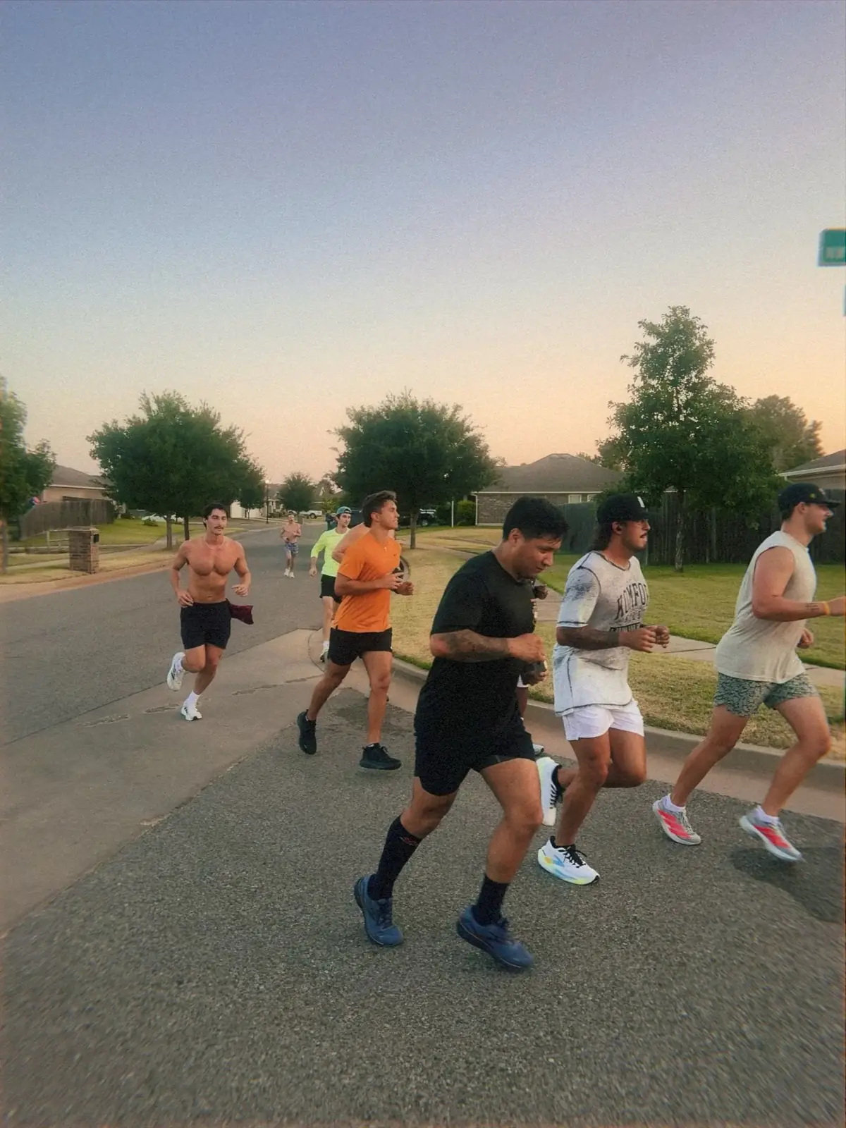 Meantime hangout runners on a neighborhood street at golden hour