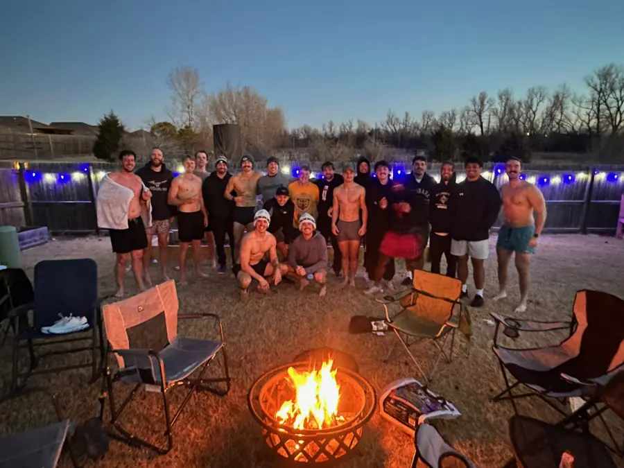 Meantime group photo by campfire light